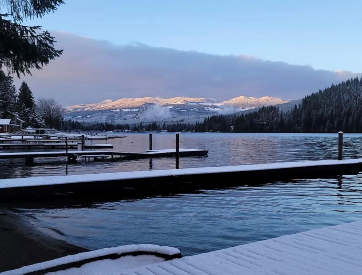 Snow blanketing the lakeside docks.
