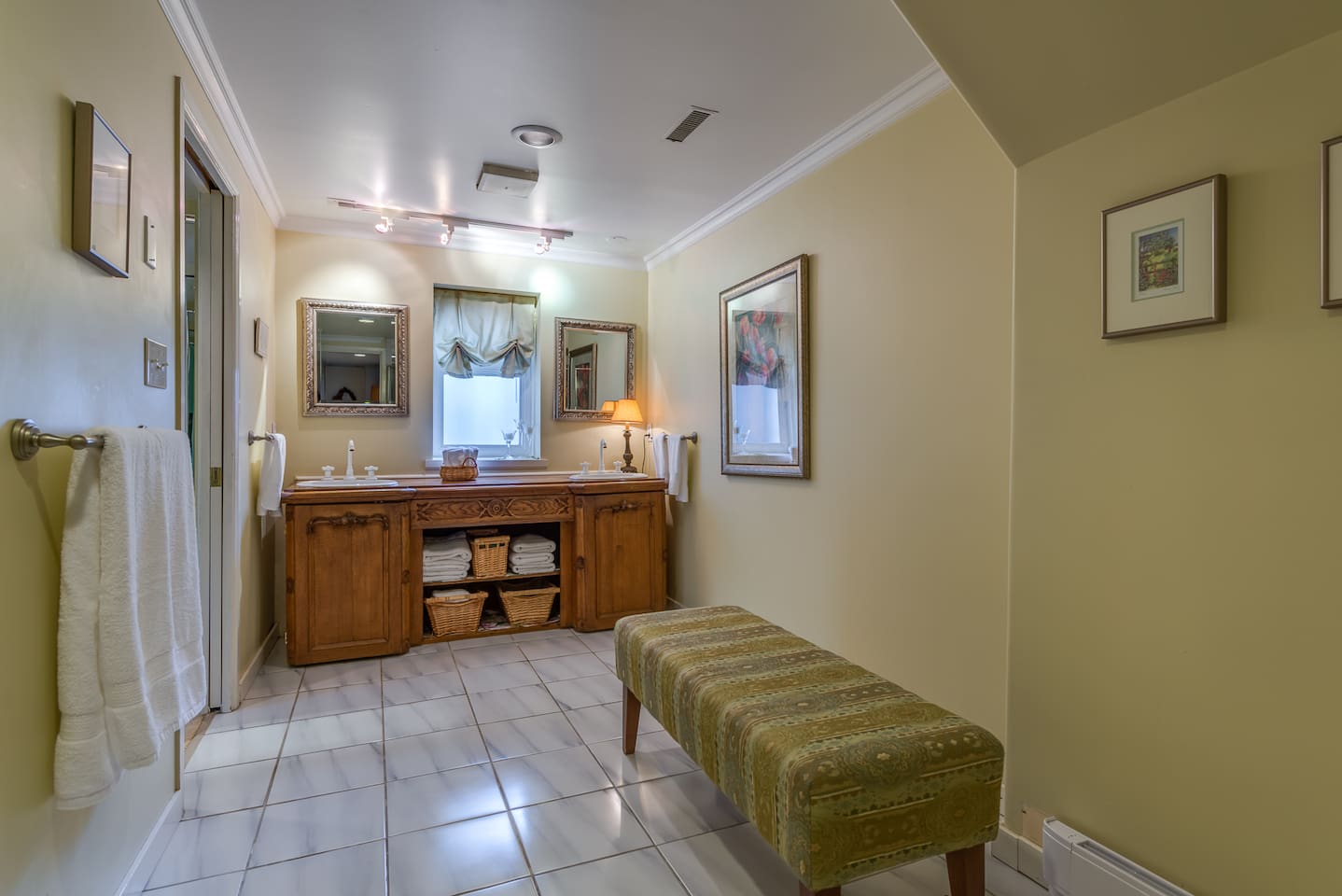 Master bathroom - antique sideboard serves as the bathroom counter.