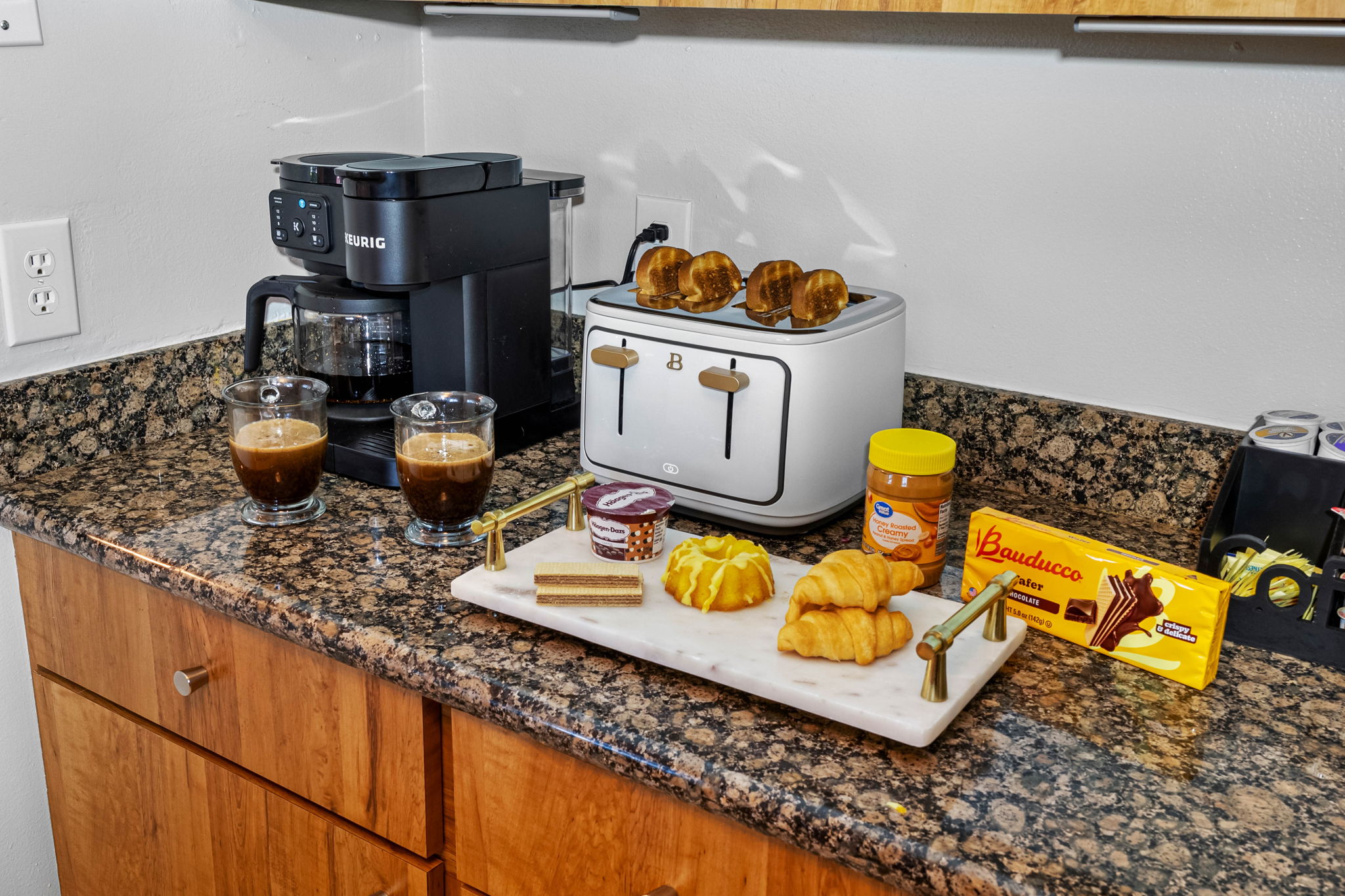 This fully equipped kitchen features gleaming granite countertops, warm wood cabinetry, and modern stainless steel appliances—making it as functional as it is inviting for your inner chef.