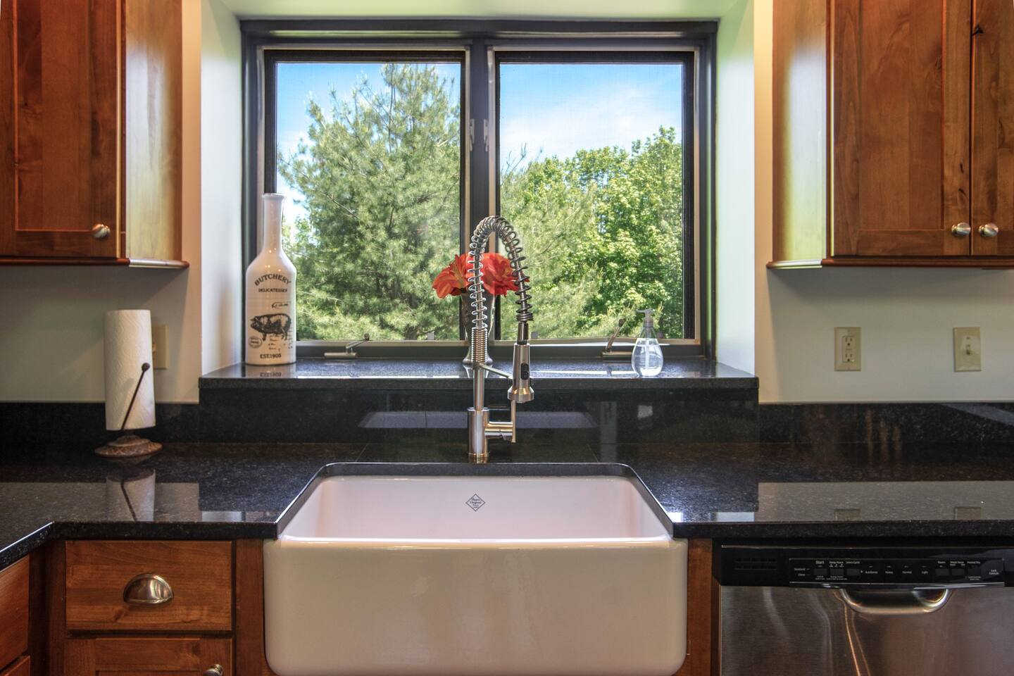The spacious kitchen, complete with modern appliances and a large island, is perfect for preparing meals and entertaining guests.