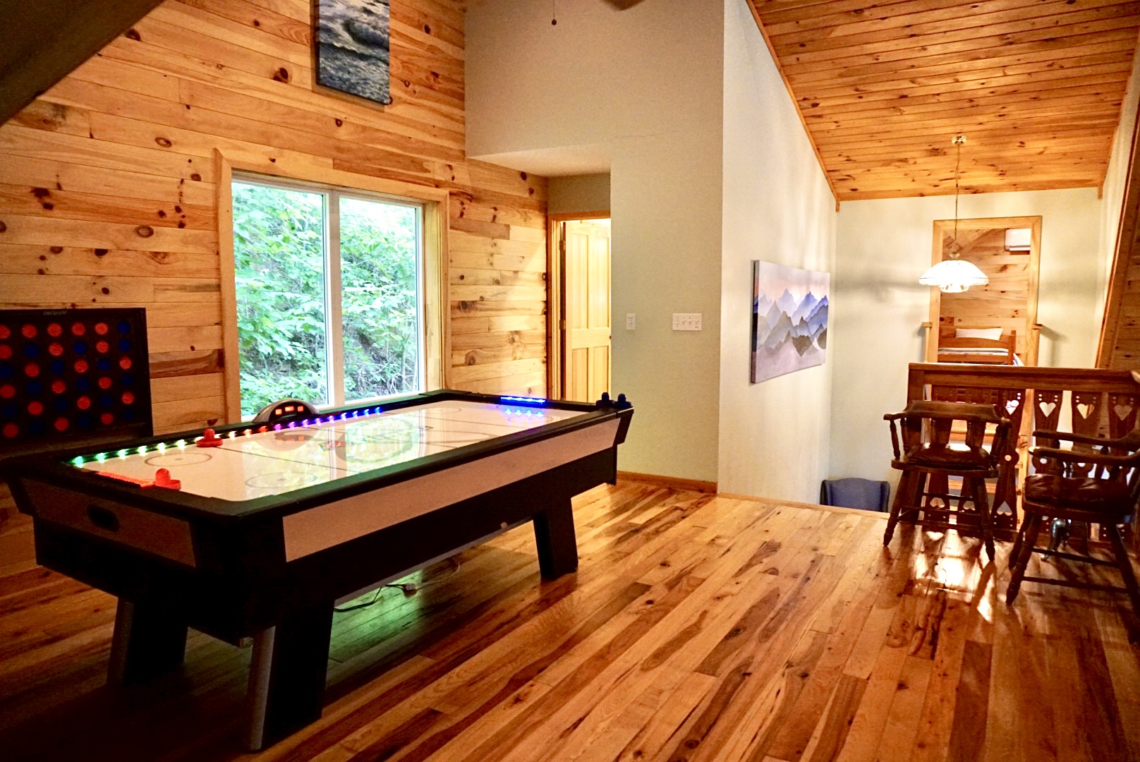 Game Room: Experience fun-filled evenings with air hockey and stunning forest views!