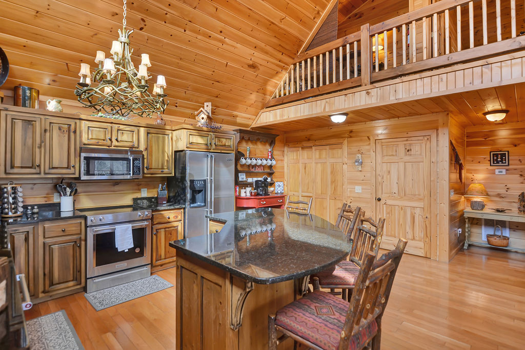 Spacious Kitchen with New Appliances and Bar Sitting Area