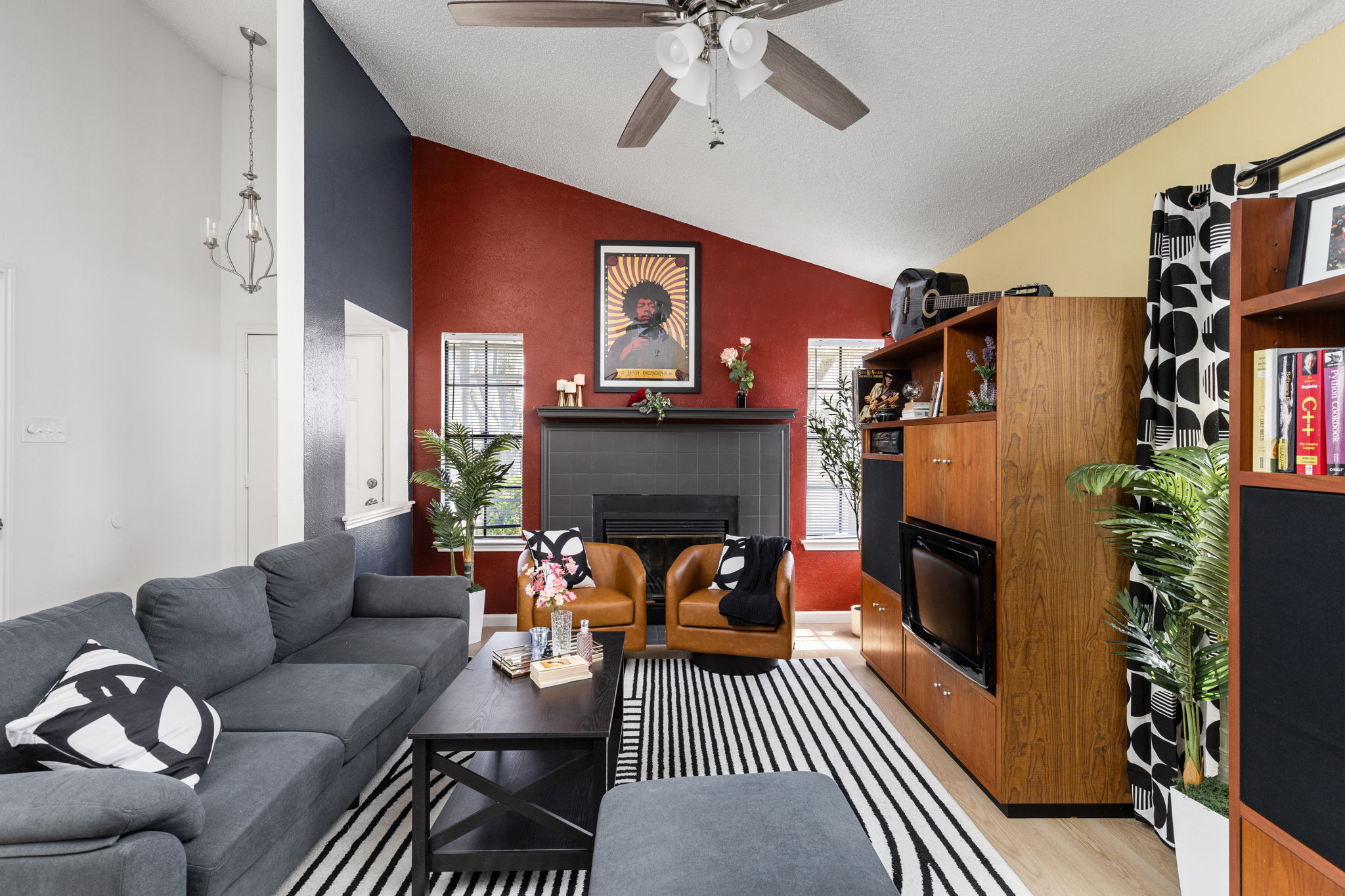 Gather in a stylish living space where bold accents and cozy seating create the perfect place to relax and connect. Whether it’s movie night or quiet downtime, it feels effortlessly inviting.