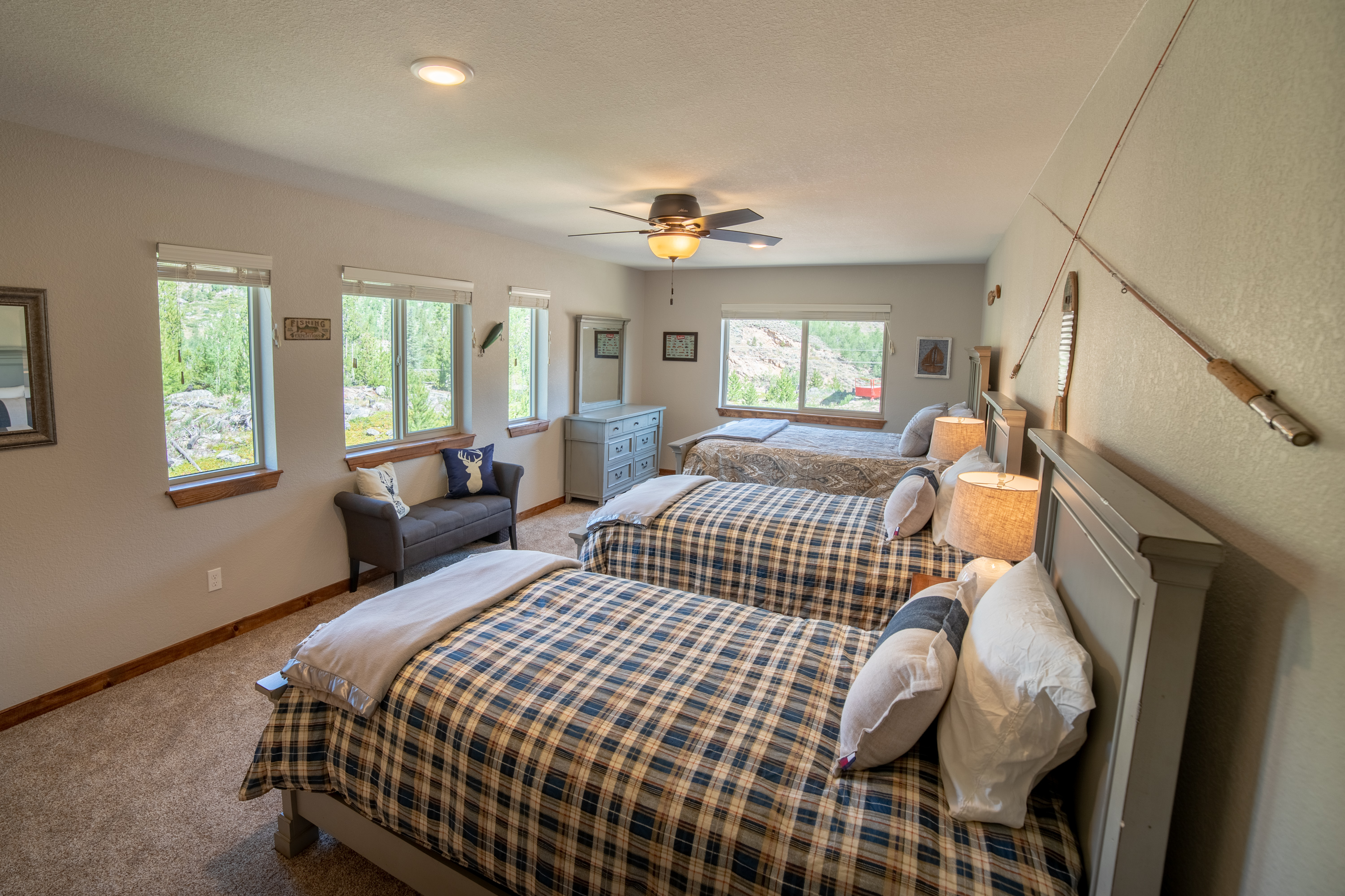 Upstairs Bedroom 4 Cozy queen bed with two twin beds, ideal for families or groups looking to unwind in style after a day of adventure!