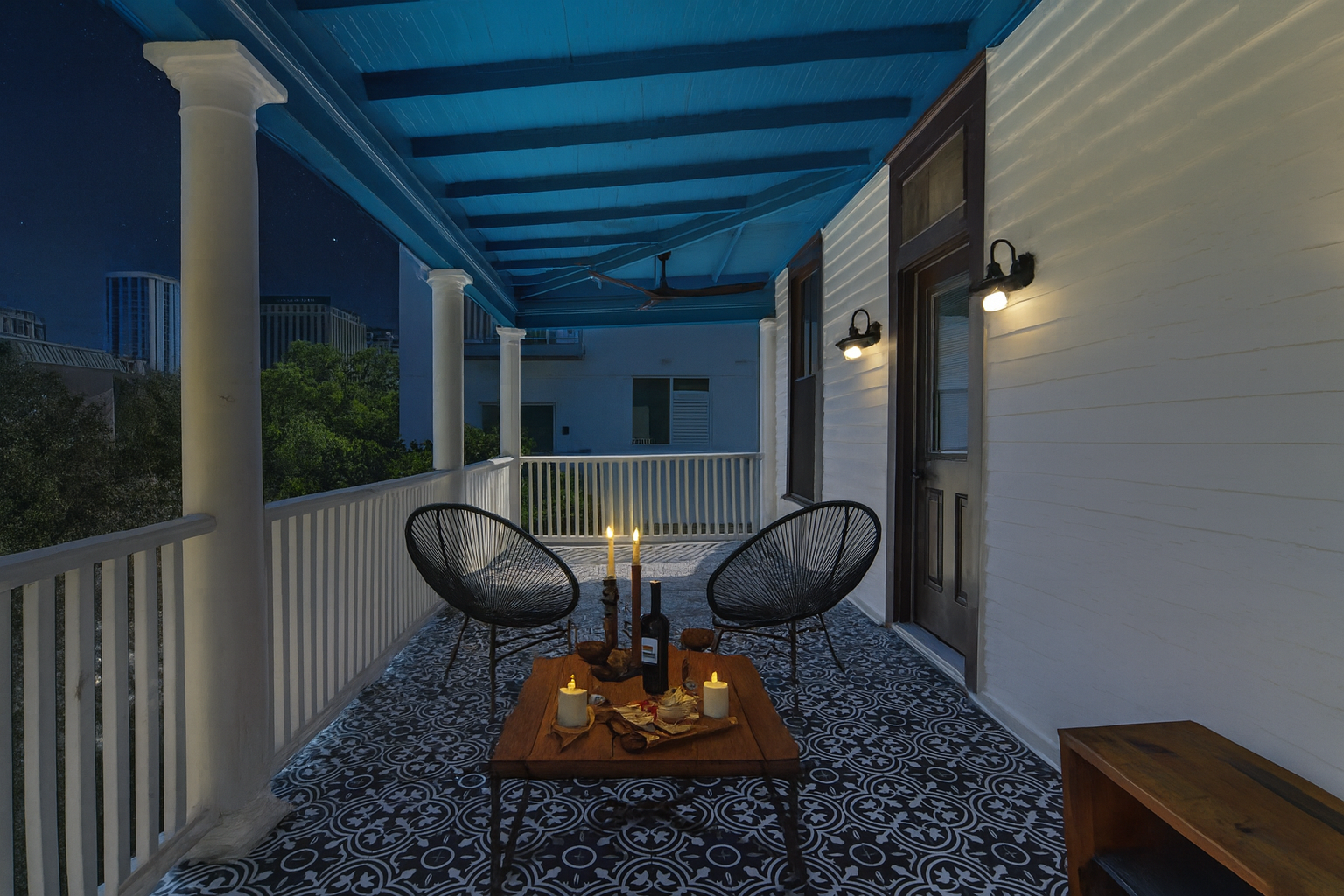 sitting on patio overlooking downtown austin with a glass of wine