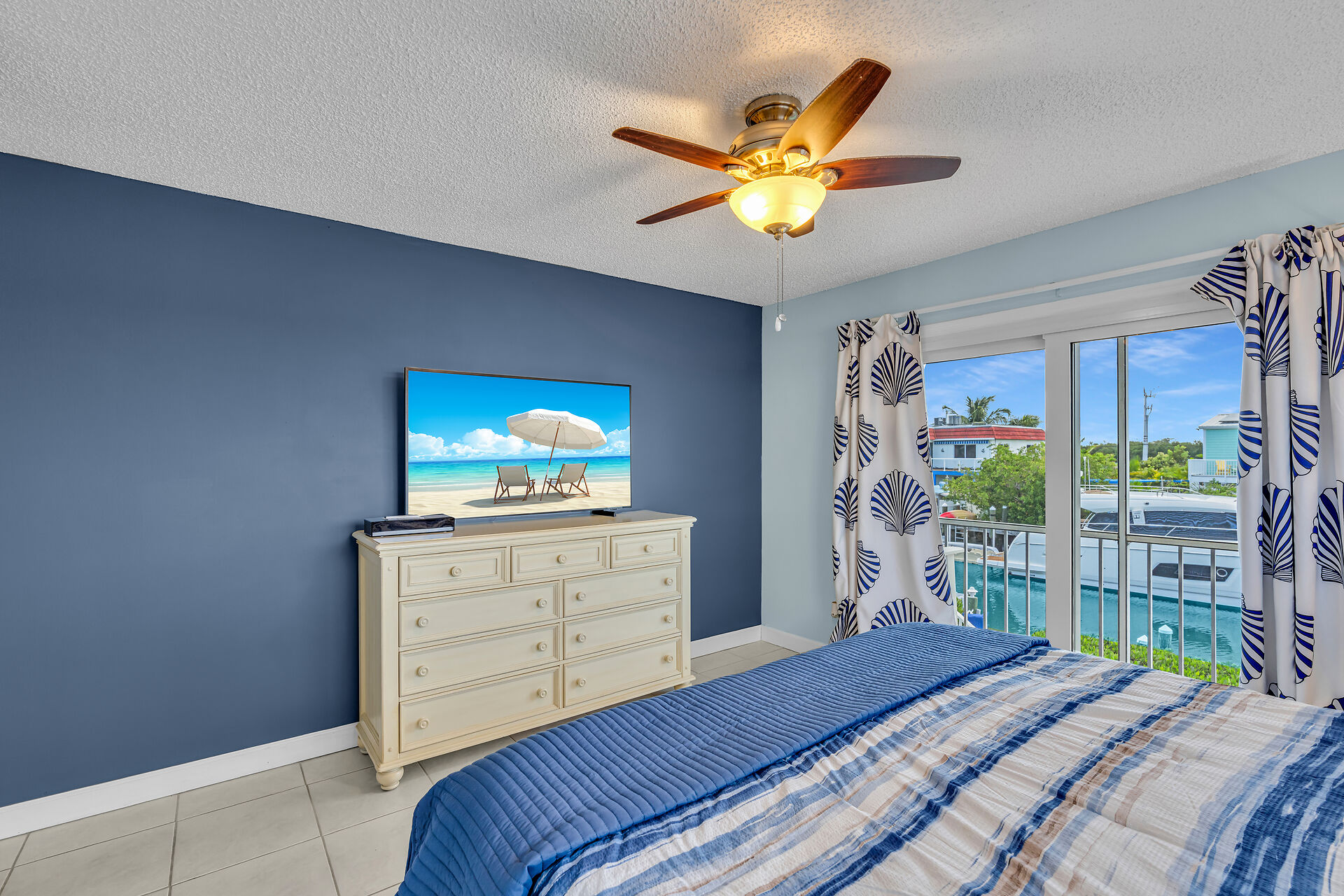 Primary bedroom overlooking waterway