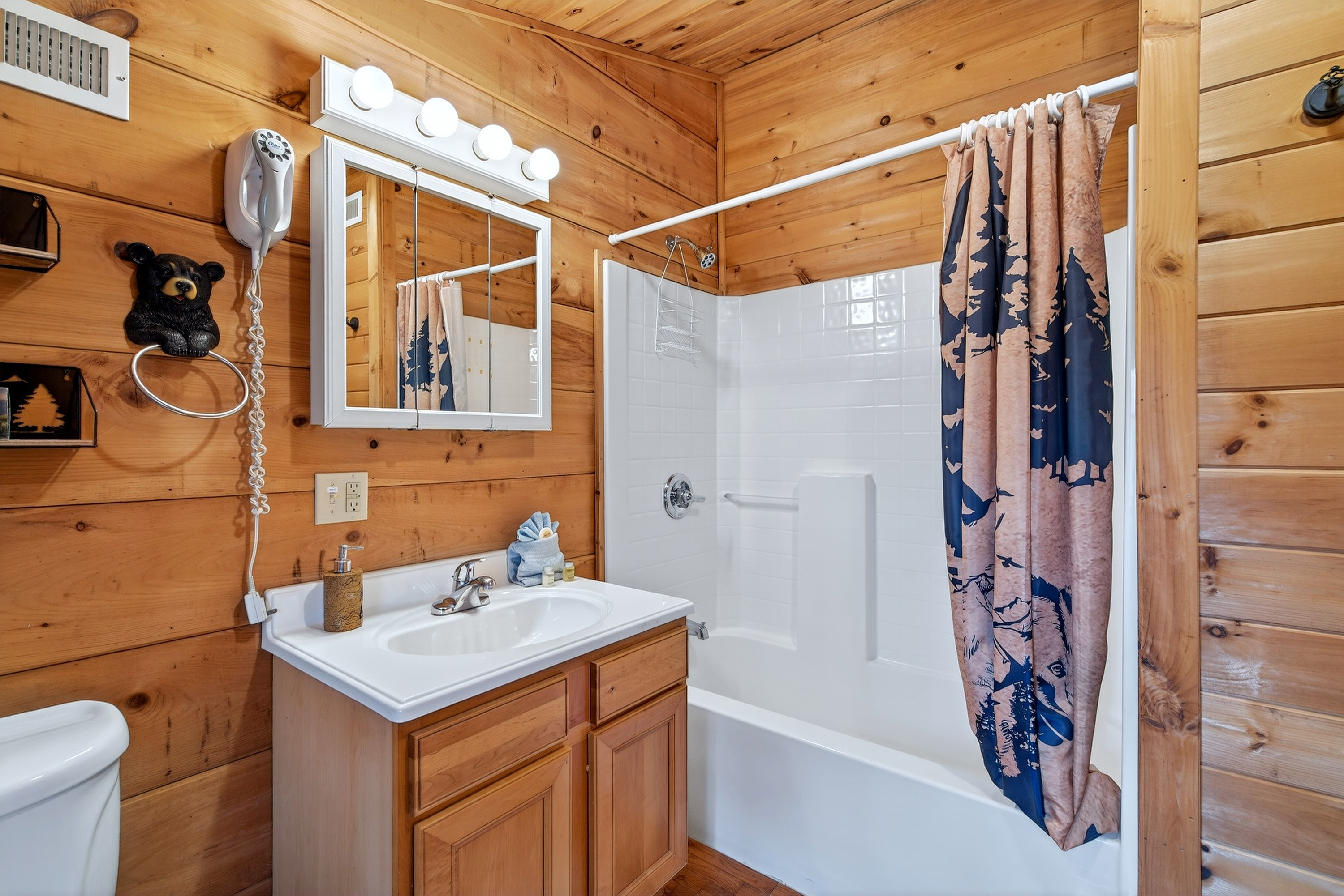 Upstairs bathroom with combination shower and bathtub 