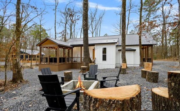 Gather around the fire pit beneath the pines