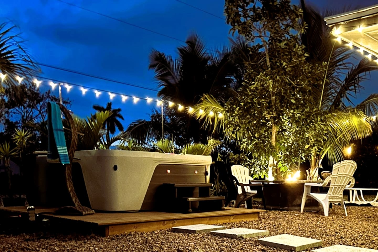 Epic Outdoor Living Space, with a Lush, Tropical landscape to transport you to a state of Relaxation, While enjoying all this paradise has to offer, featuring a spa and gas fire pit, with plenty of seating.