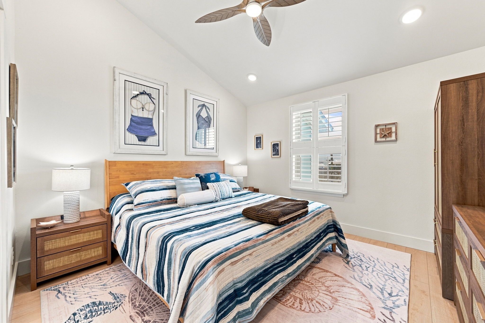 Room to relax and room to unpack, with a comfortable king bed, convenient storage, and a ceiling fan overhead.
