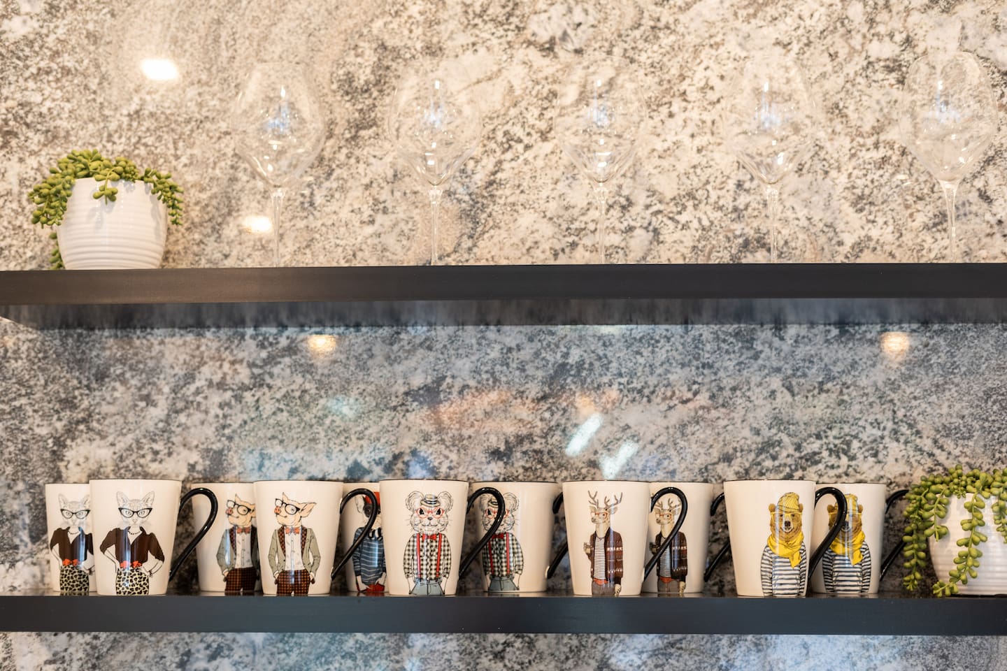 Character mugs and glassware on display.

