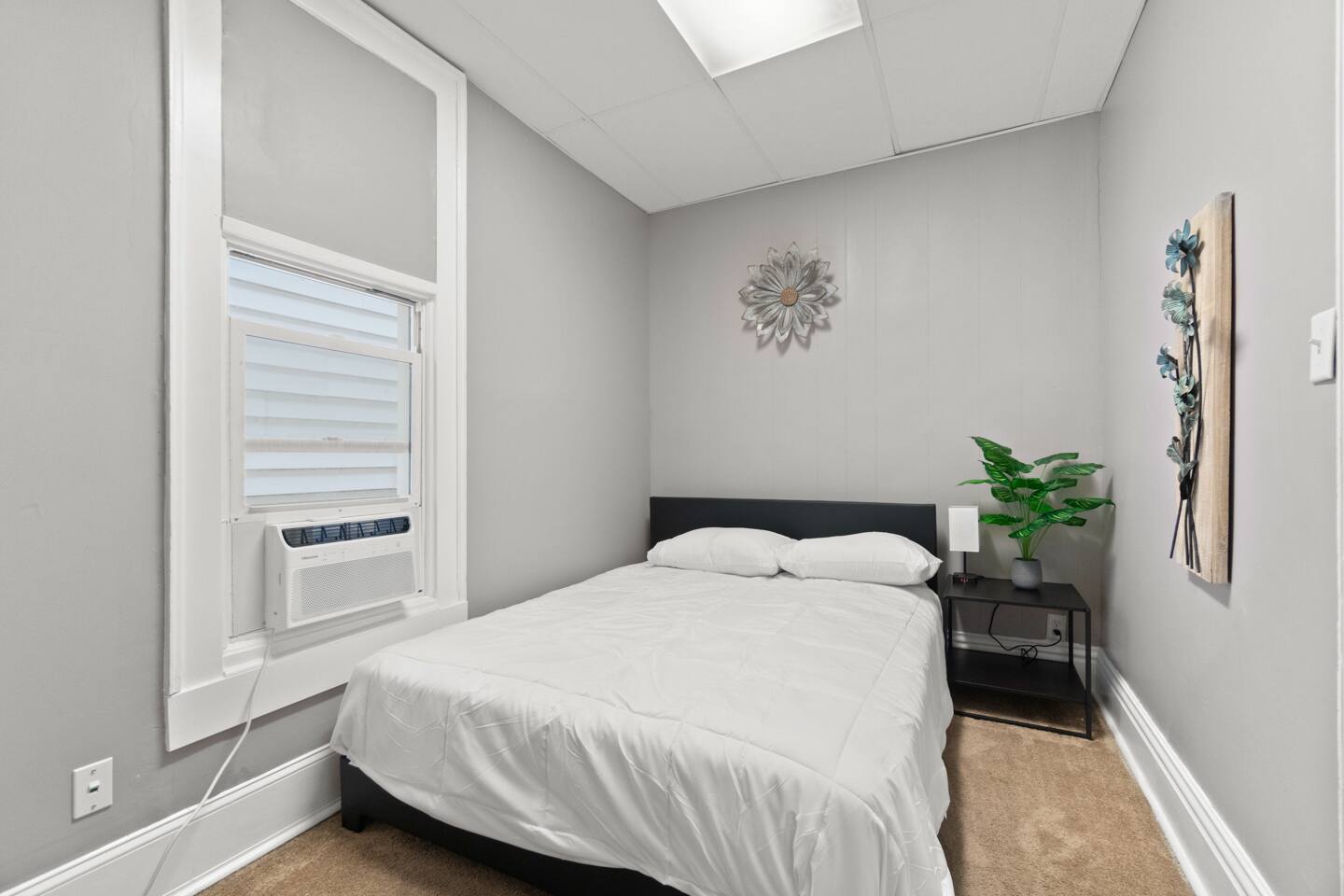 The bedroom features a plush queen-sized bed for ultimate comfort and relaxation.