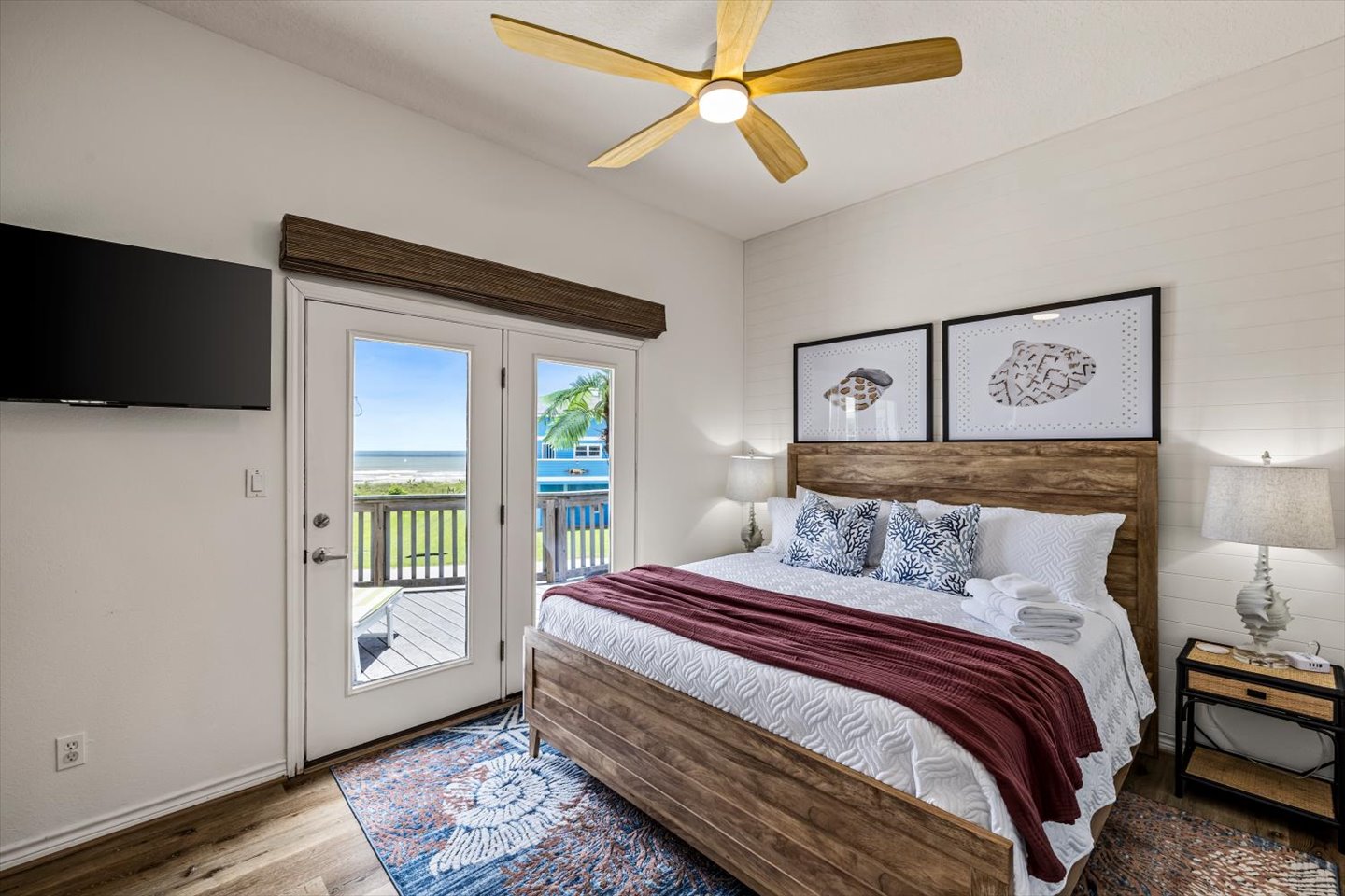 The Shell primary suite on the main level has access to the deck, and views for miles of the Gulf. The roller shades are remote controlled and black out for privacy. 