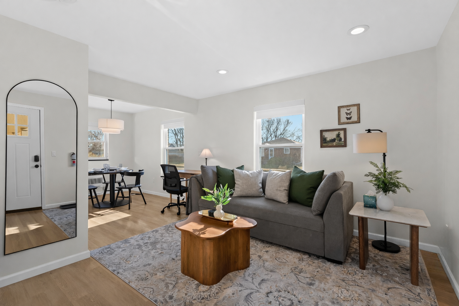 Bright, open living space with stylish seating, cozy accents, and natural light—perfect for relaxing, working remotely, or unwinding after a day out.