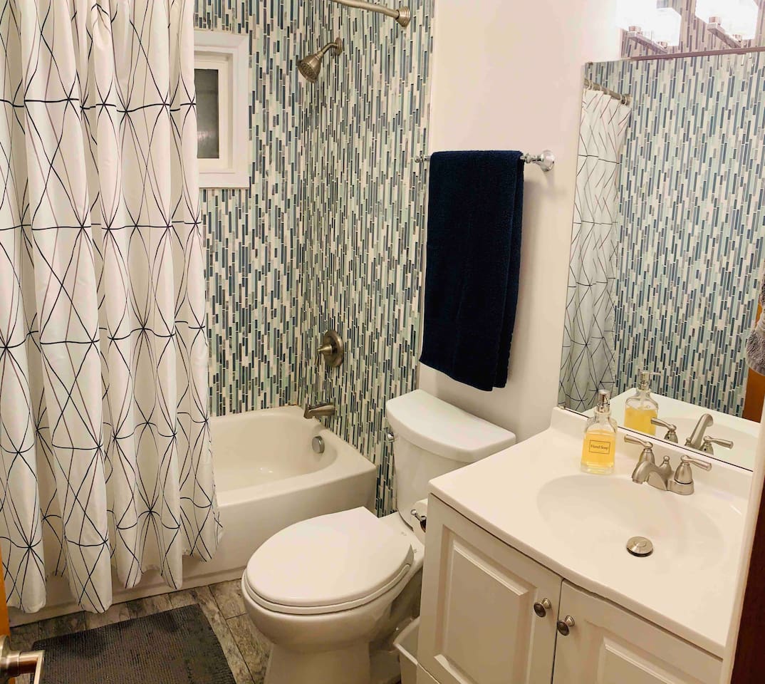 Full bathroom upstairs with shower