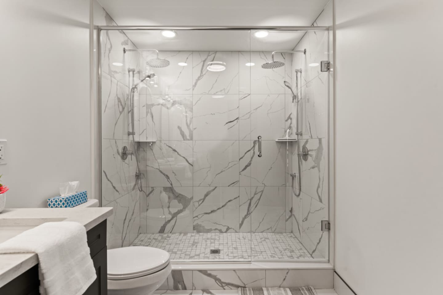 3rd floor ensuite bathroom features a spacious shower with double rain shower heads.