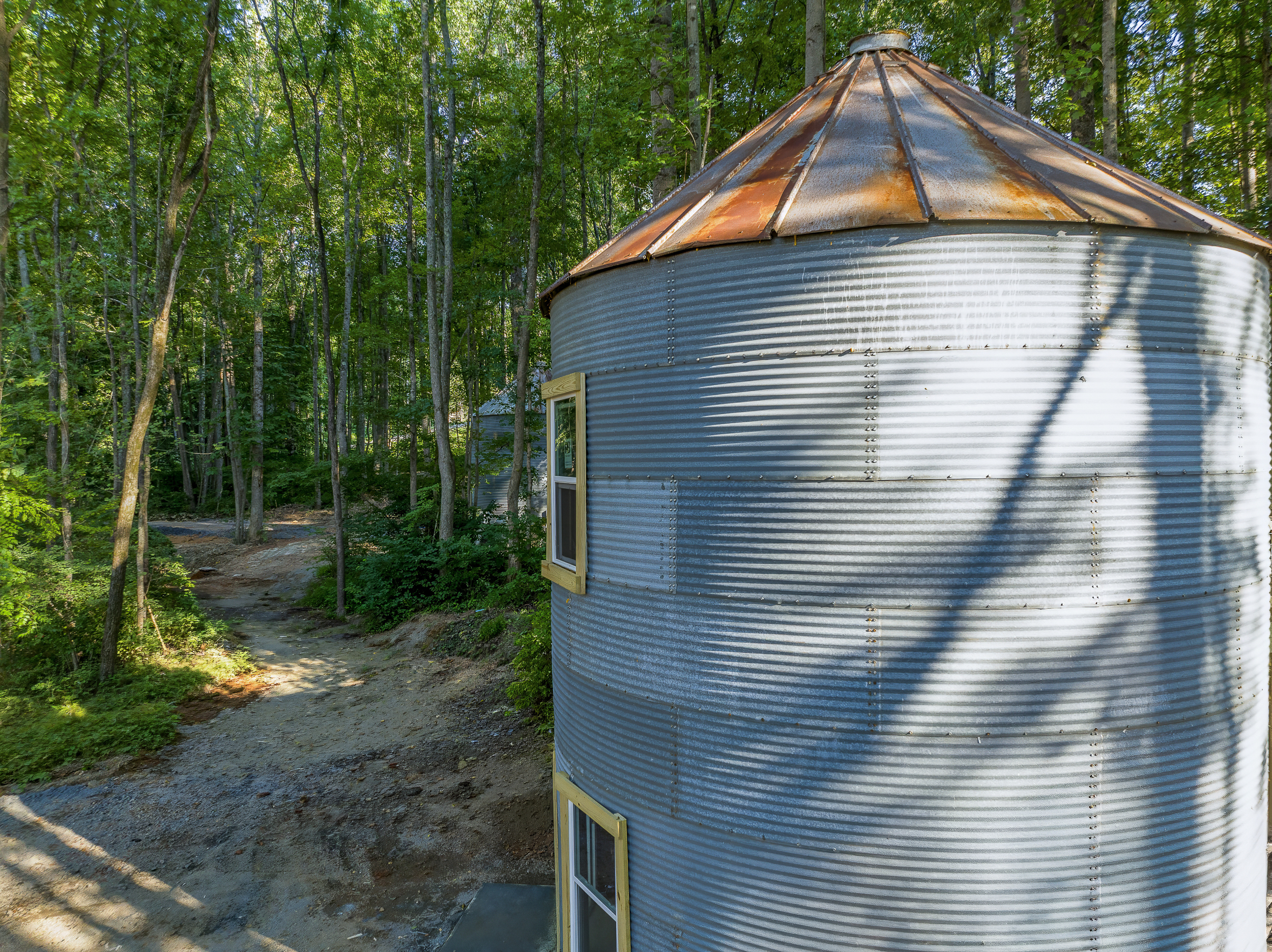Unique Stay: Experience a charming silo retreat surrounded by lush greenery and tranquility!