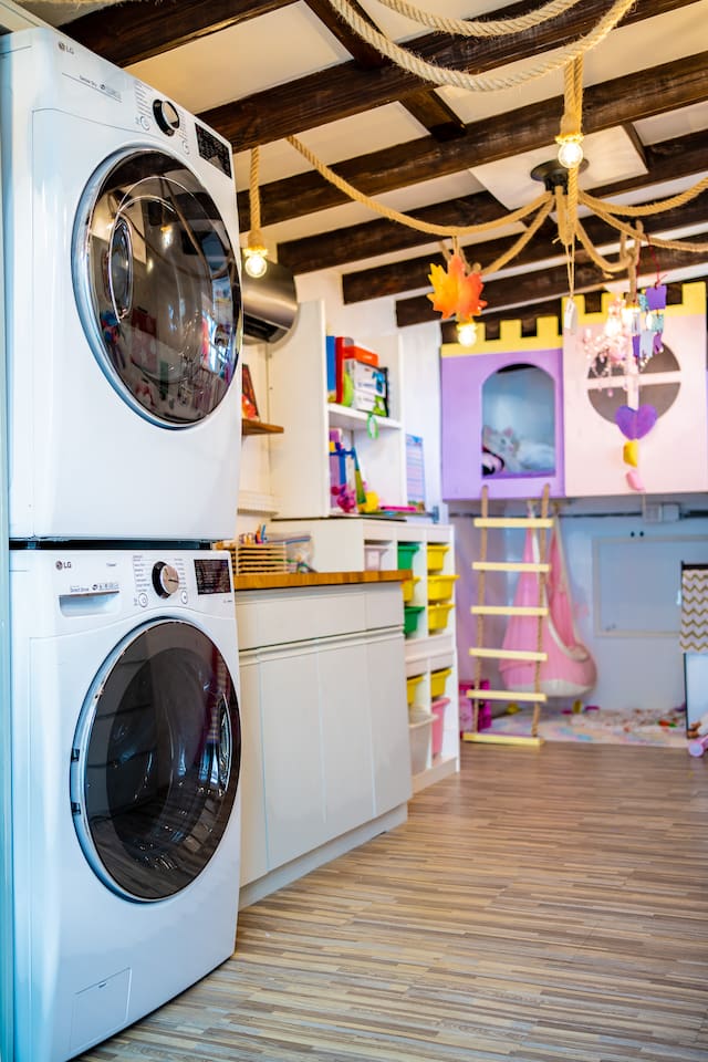 This is the laundry/playroom. If you have kids(especially little girls), you will LOVE this room! Our girls go into here for hours! There is a swing chair, play kitchen, books, crafts, upper loft, slide. You are free to relax in the pool:)