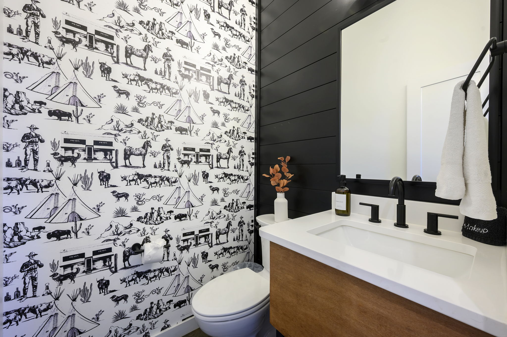 Half bathroom with chic modern design. Conveniently located near the main living area. 