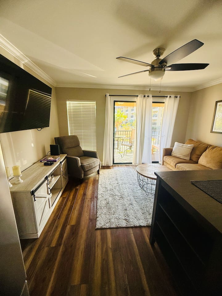 Living room with Smart TV and balcony doors