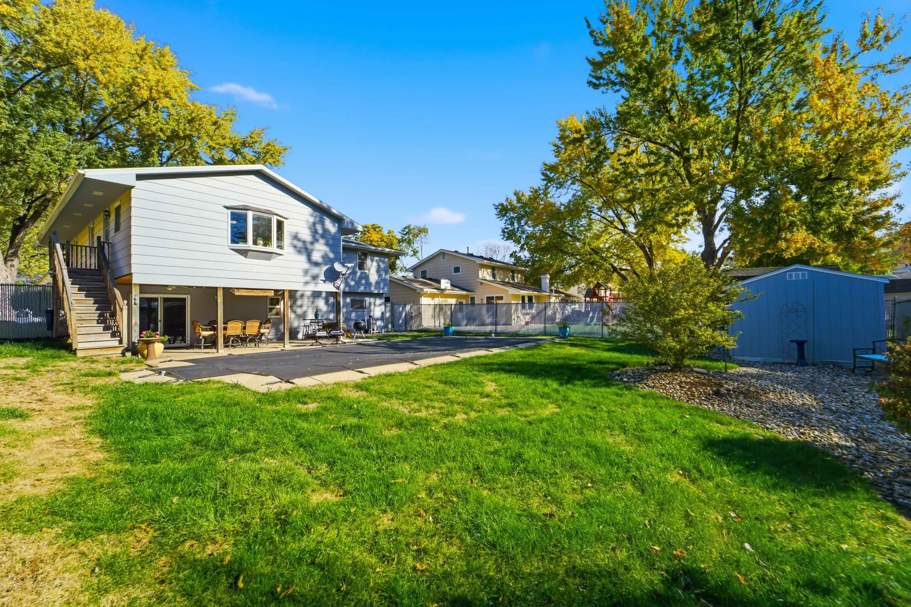 The fully fenced backyard and person rated pool cover accommodates for well-behaved furry friends to roam and play!