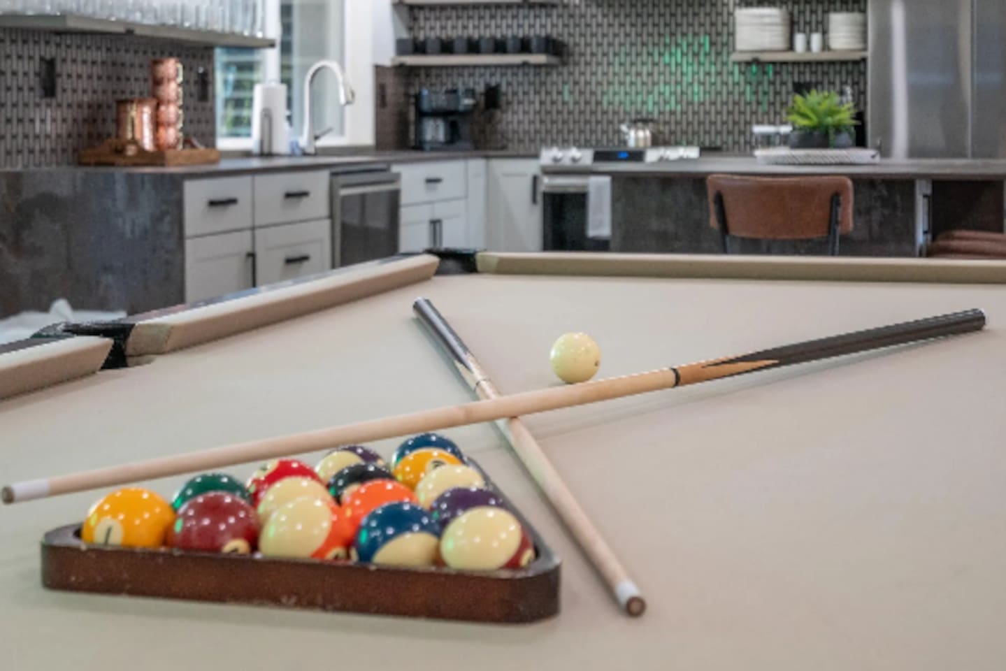 Balls racked and cues ready, this table is set for a friendly night of pool.