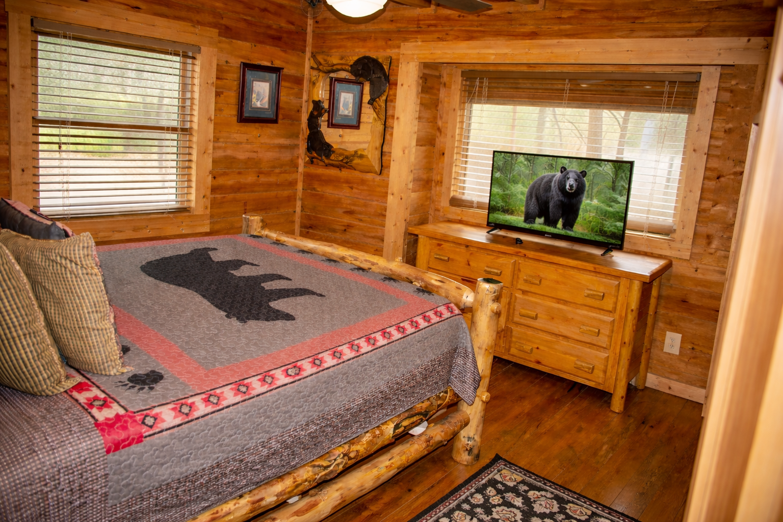 Main level bedroom with queen sized bed.