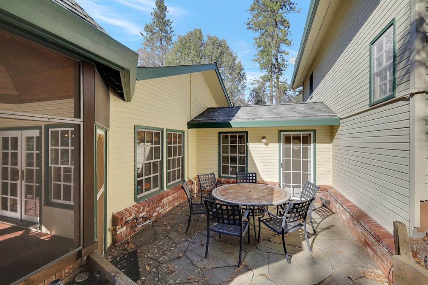 Small patio with outdoor dining, screened porch access, and a tucked-away spot for fresh air.
