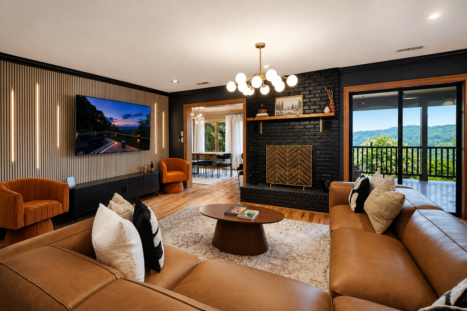 {Main Living Room} Gather around the statement fireplace in this spacious designer lounge, featuring plush seating, a dramatic feature wall, and sweeping mountain views just beyond the glass doors.