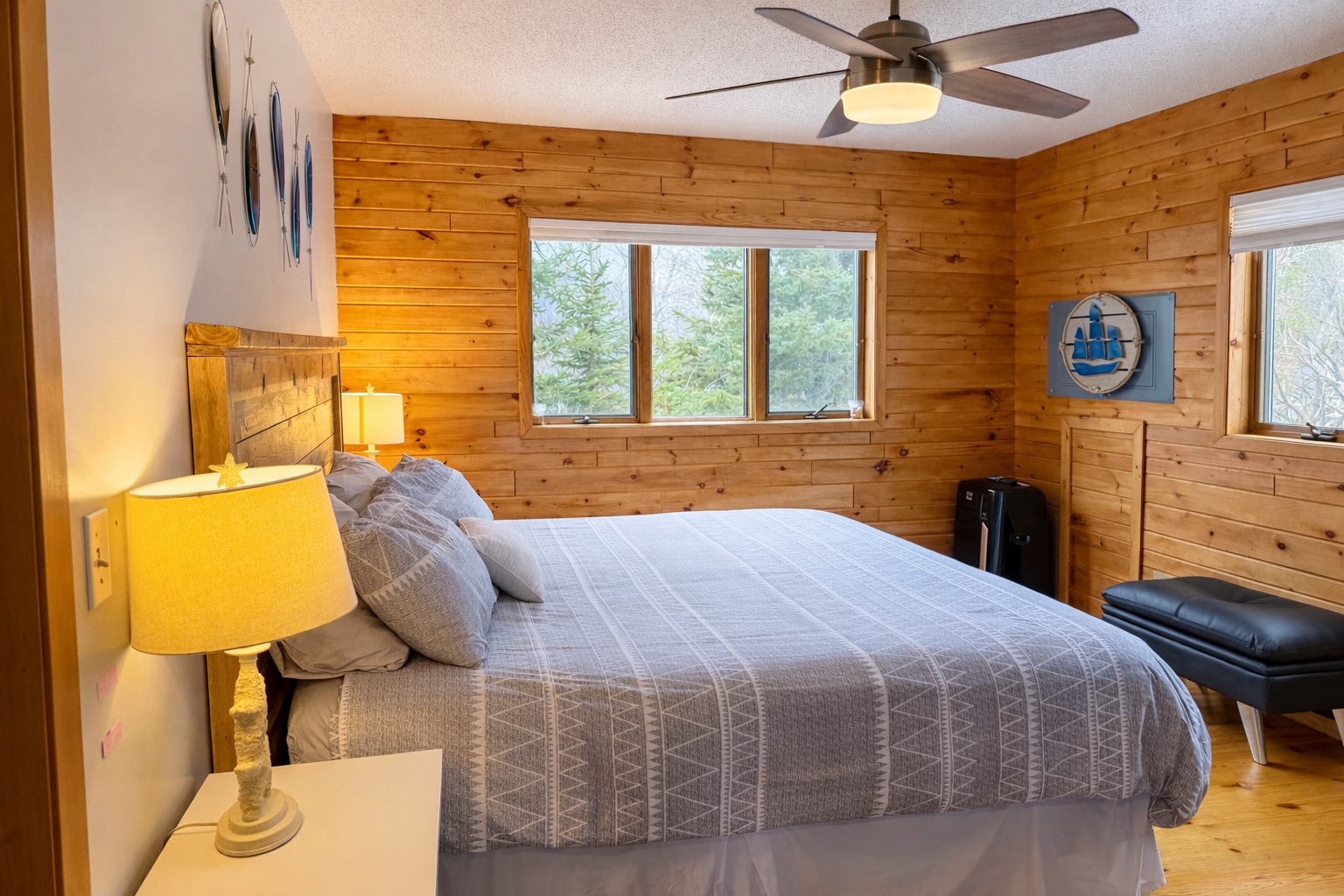 Cozy primary bedroom with a peaceful and open feel.  A calm retreat to unwind after a day on the North Shore, offering comfort, natural light, and a relaxing place to recharge for tomorrow’s adventures.