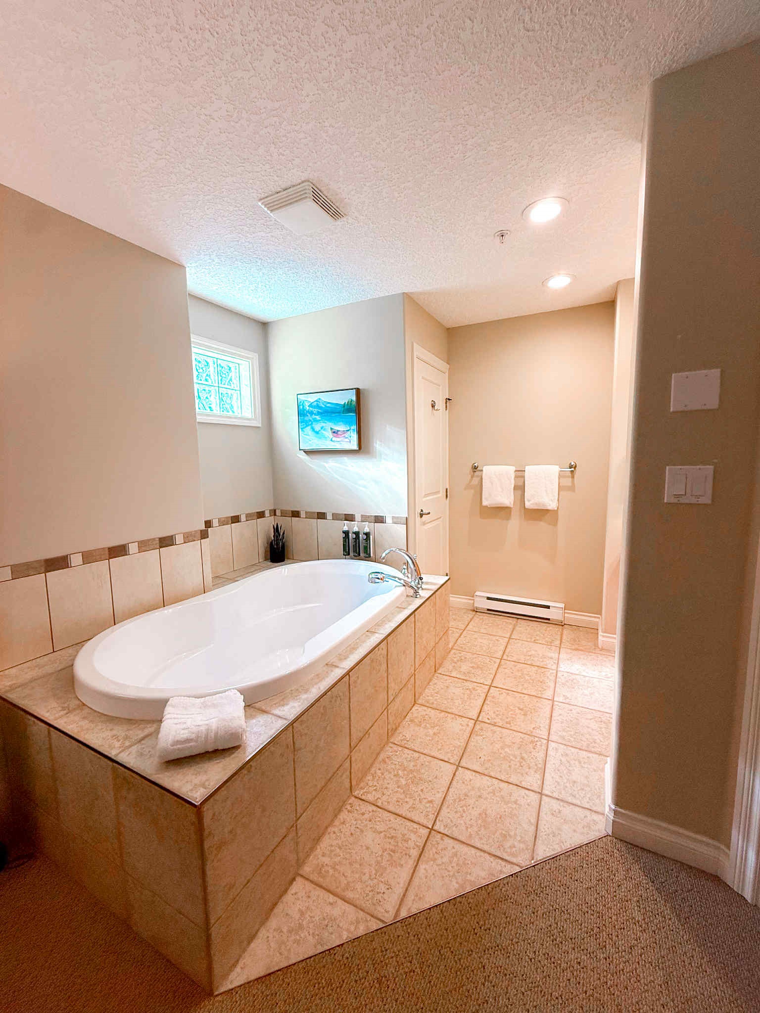 Unit A Soaker tub right in primary suite.