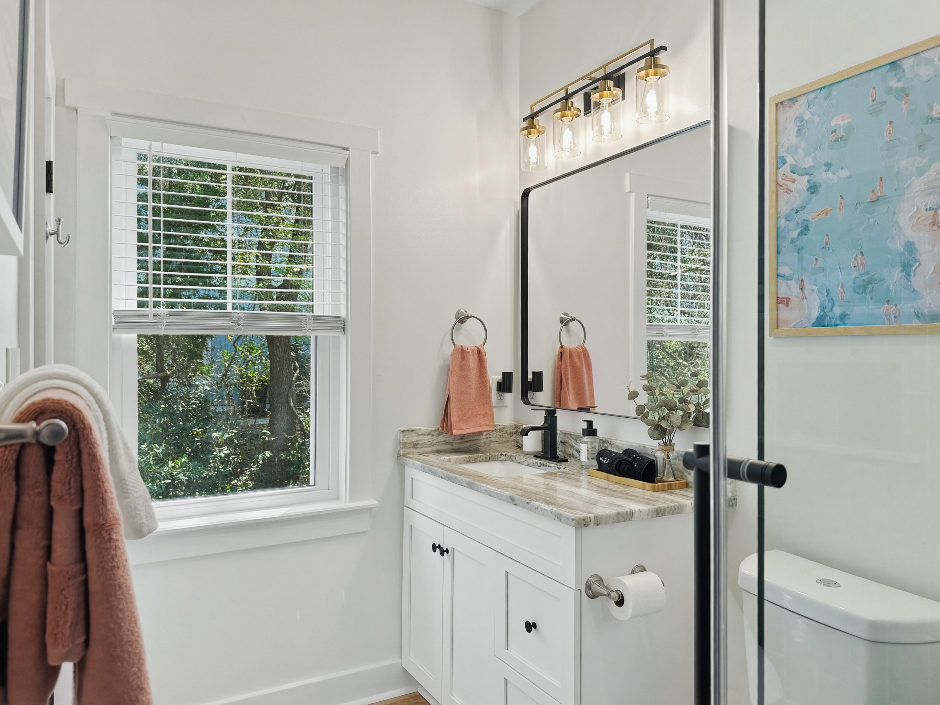 This bathroom has a bright single vanity.