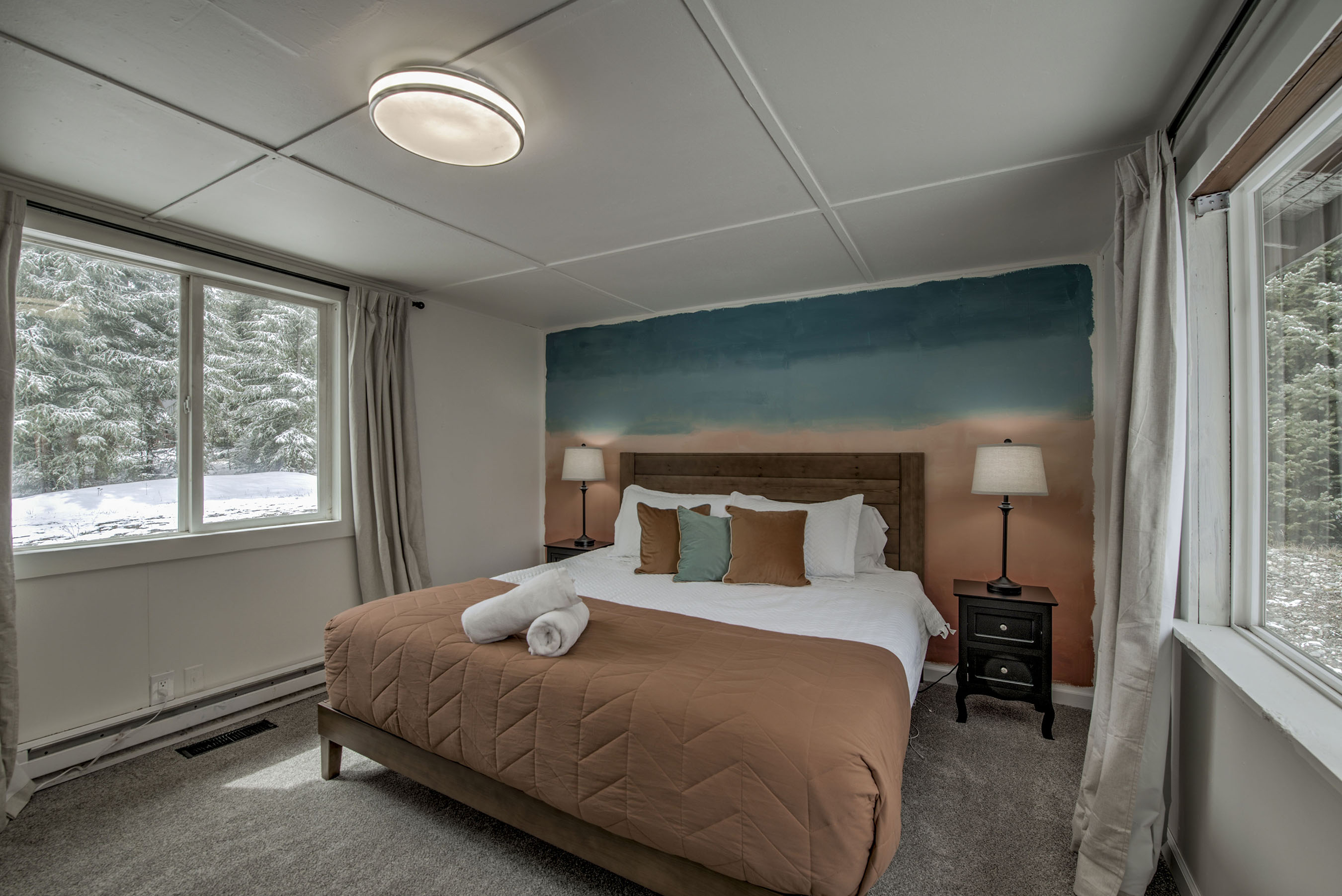 Unwind in your serene bedroom—soft textures, calming tones, and peaceful views create a relaxing retreat that’s all yours. Out the front window, you have a view of Redd Mountain, towering at 13,800 ft. 