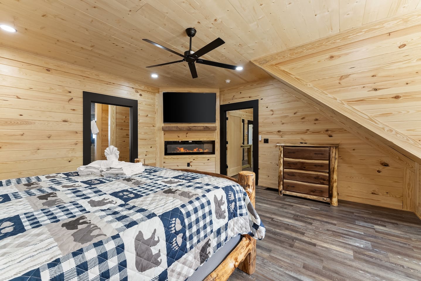 This private haven features a smart TV, built-in electric fireplace, and rustic log furniture—offering the perfect balance of comfort and style.

