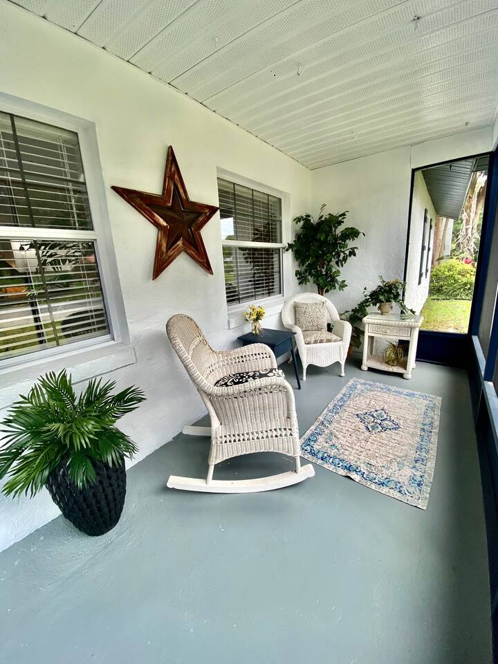 Enjoy the peace and quiet on the front screened porch.