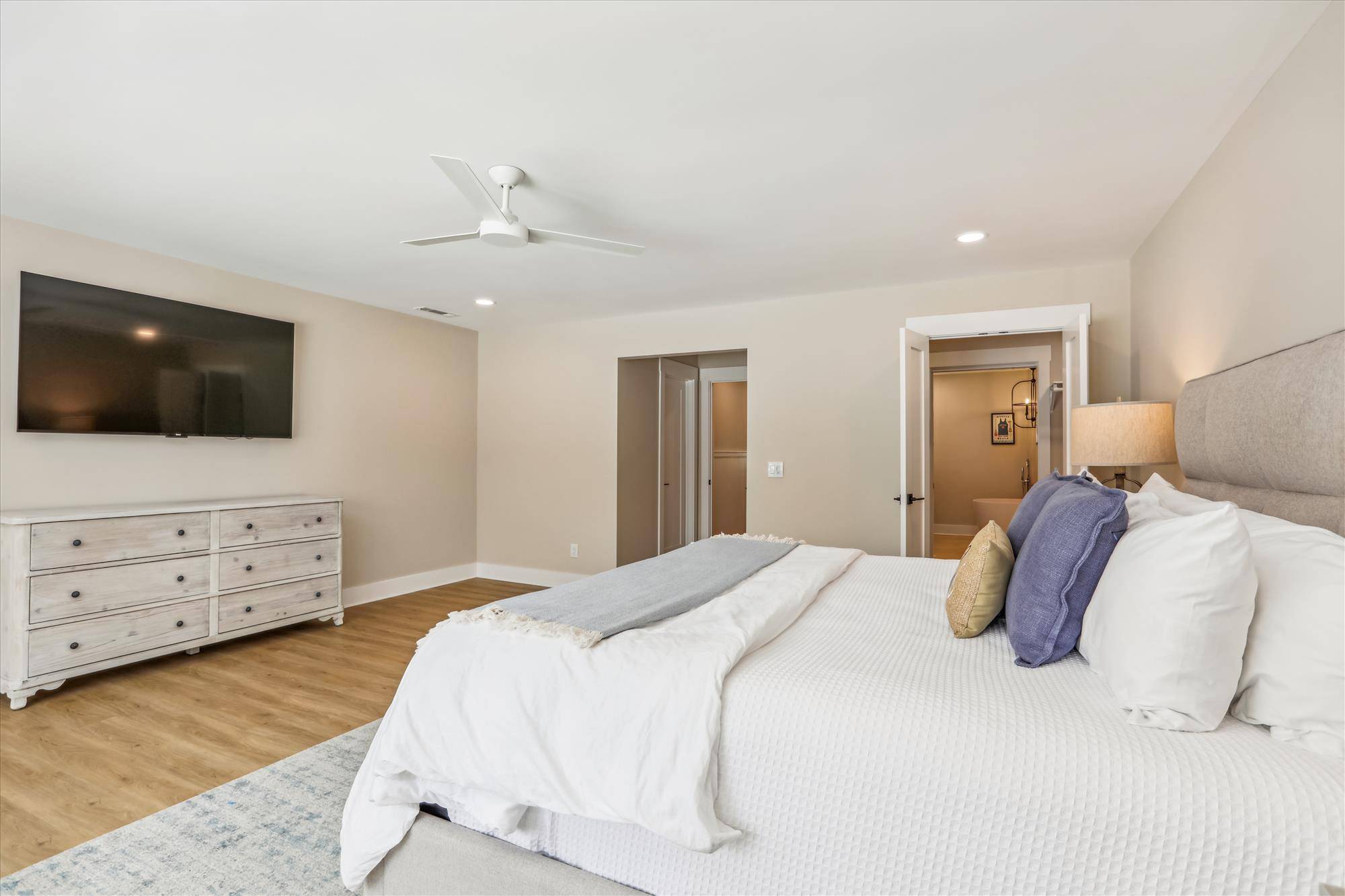 Primary bedroom fetaures a king bed