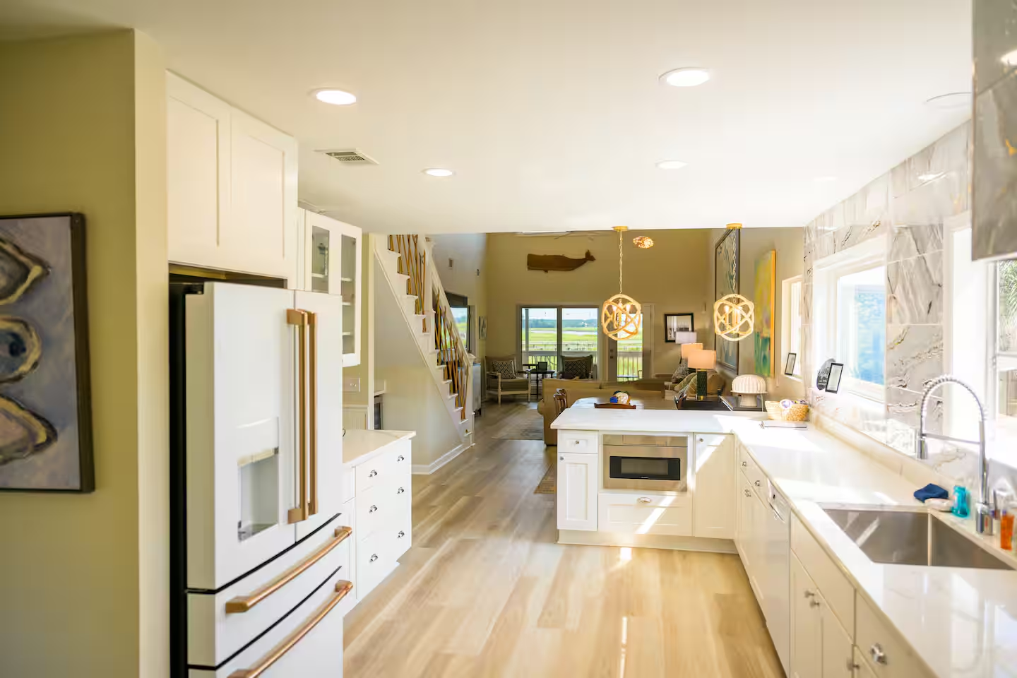 Cook, dine, and relax without missing the view—this airy layout connects you to the river from every angle.