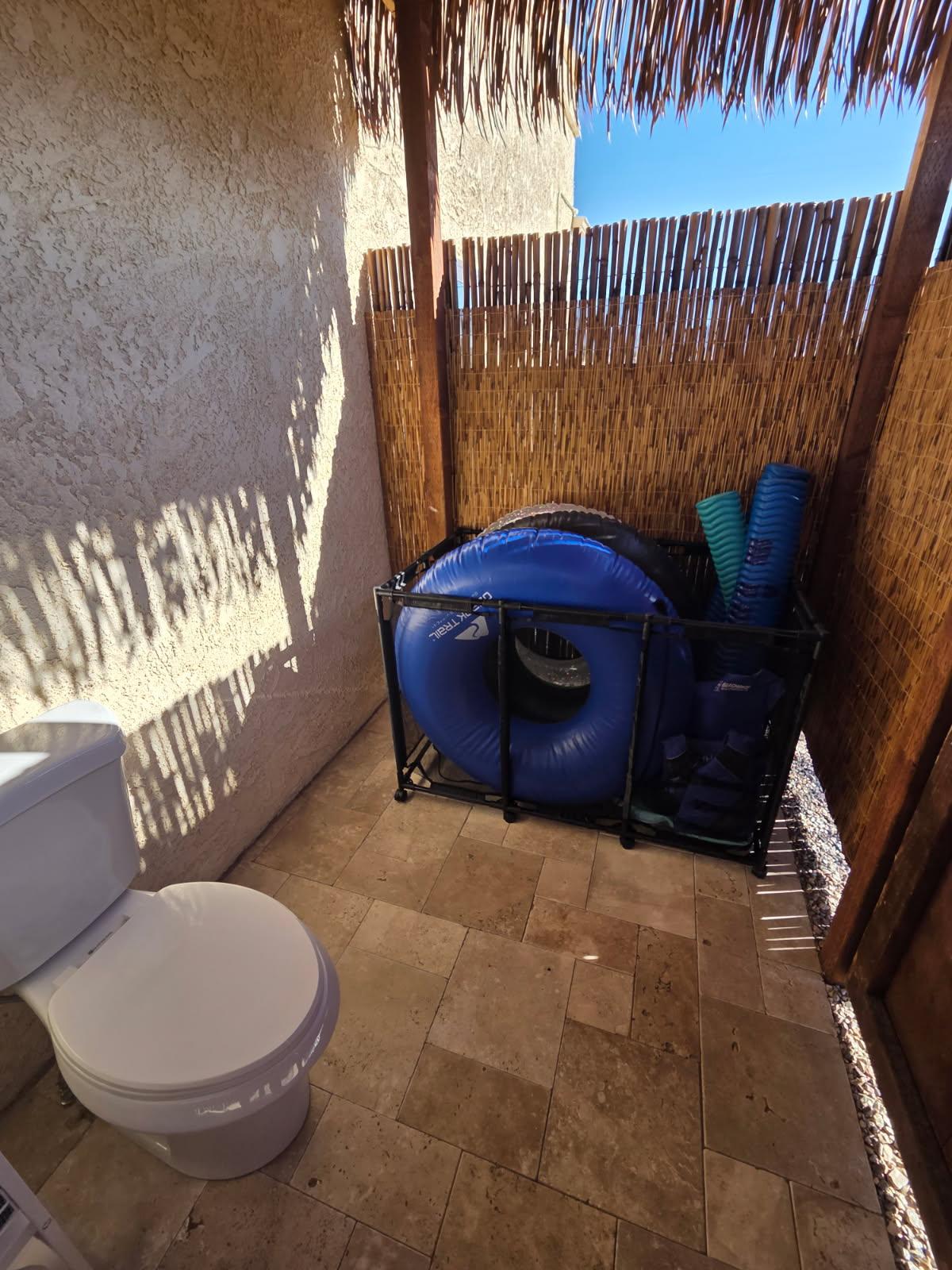Extra pool toys in pool bathroom