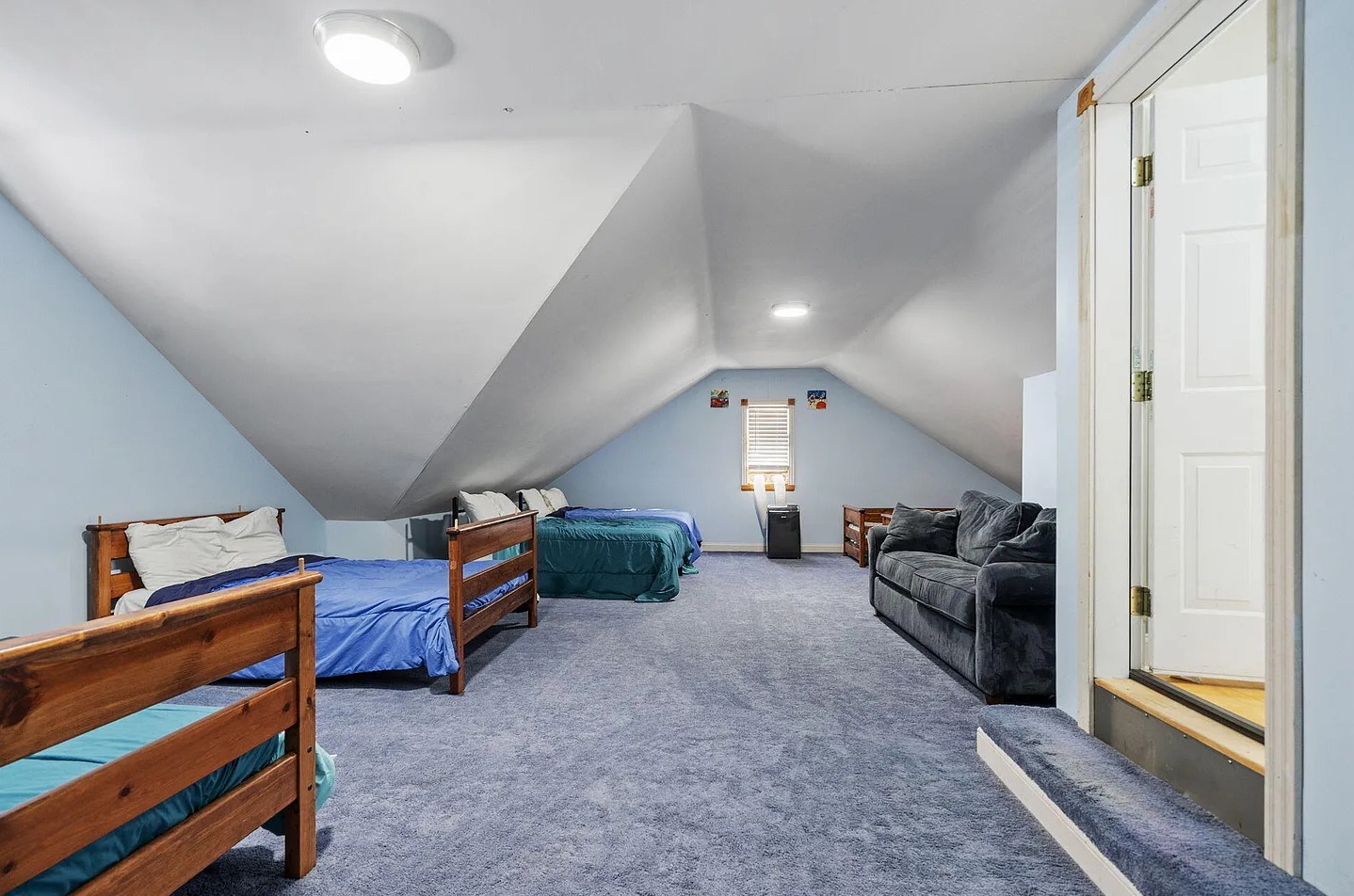 The ultimate group sleeping space - this oversized bunk room comfortably sleeps up to 10 guests and features six beds, plush carpeting, fresh updates, and a private HVAC system for personalized comfort in every season.