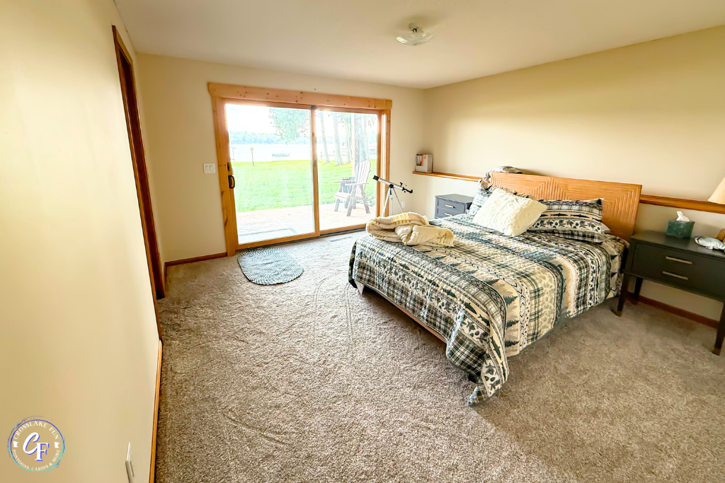 Lower-level bedroom with queen bed