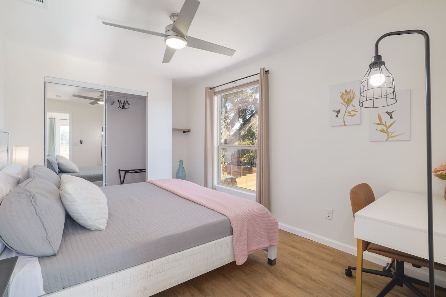Wake up slowly in this bright upstairs king bedroom, where soft linens, natural light, and peaceful surroundings create a calm retreat. Thoughtfully designed for restful nights and easy mornings during your stay.