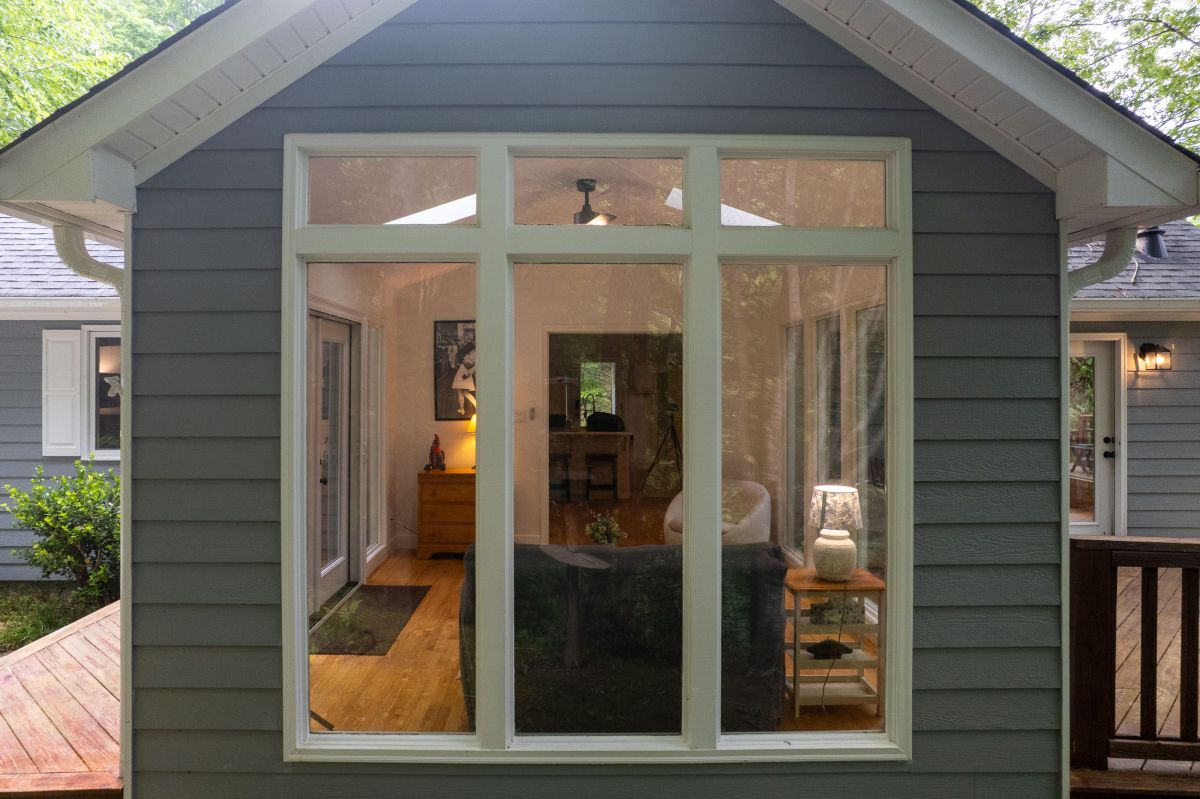 Sunlit Escape: Bright, airy room invites nature inside with stunning views and stylish decor!