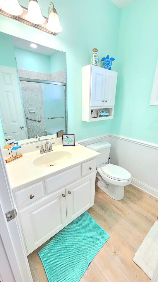 Upstairs bathroom with shower, sit down ledge in shower. 
Starter TP, shampoo, soap provided, towels and linens provided. Hair dryer provided. 