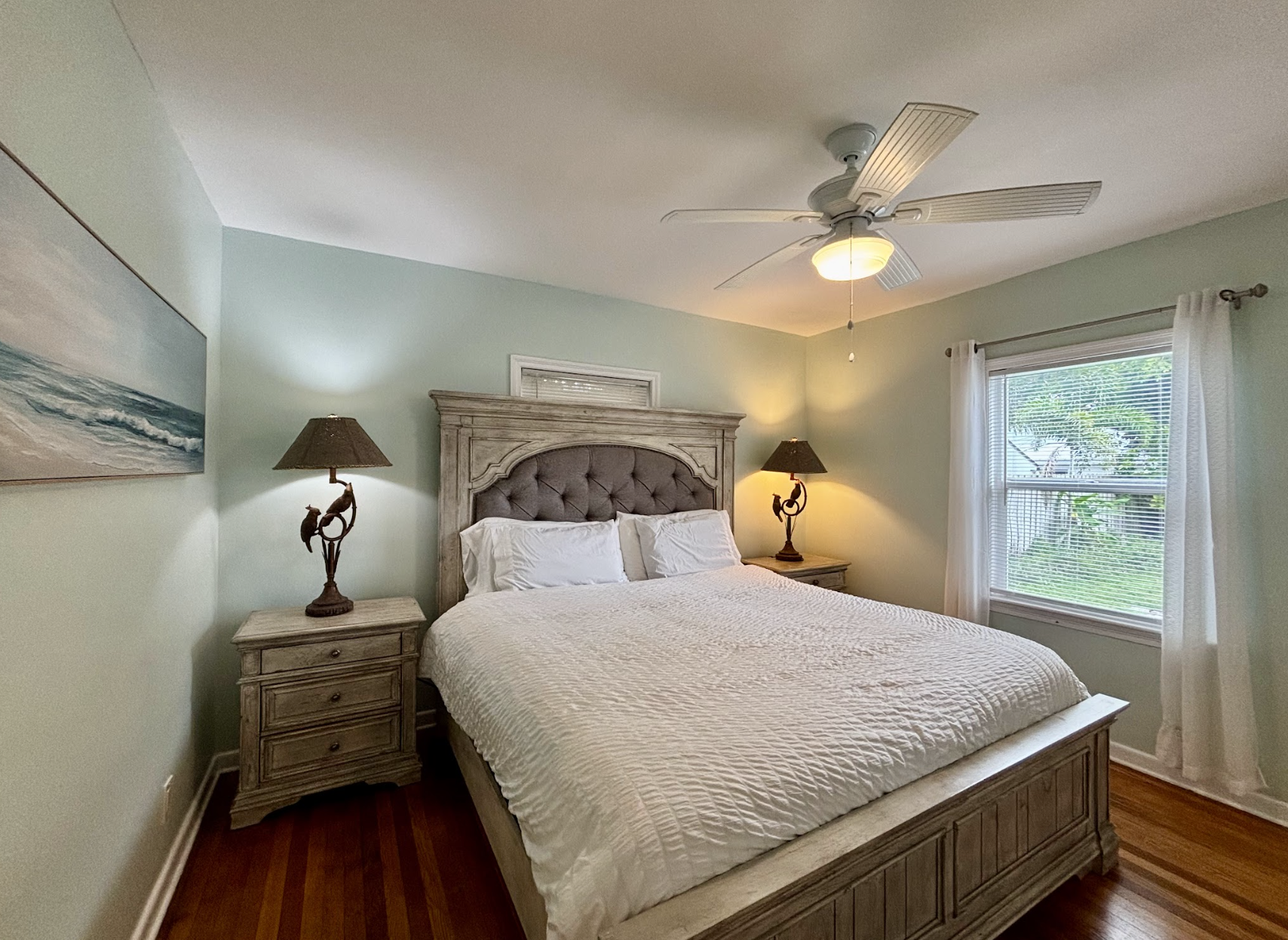 The first bedroom features a comfortable king-sized bed, facing the backyard. It also comes with an ensuite bathroom.