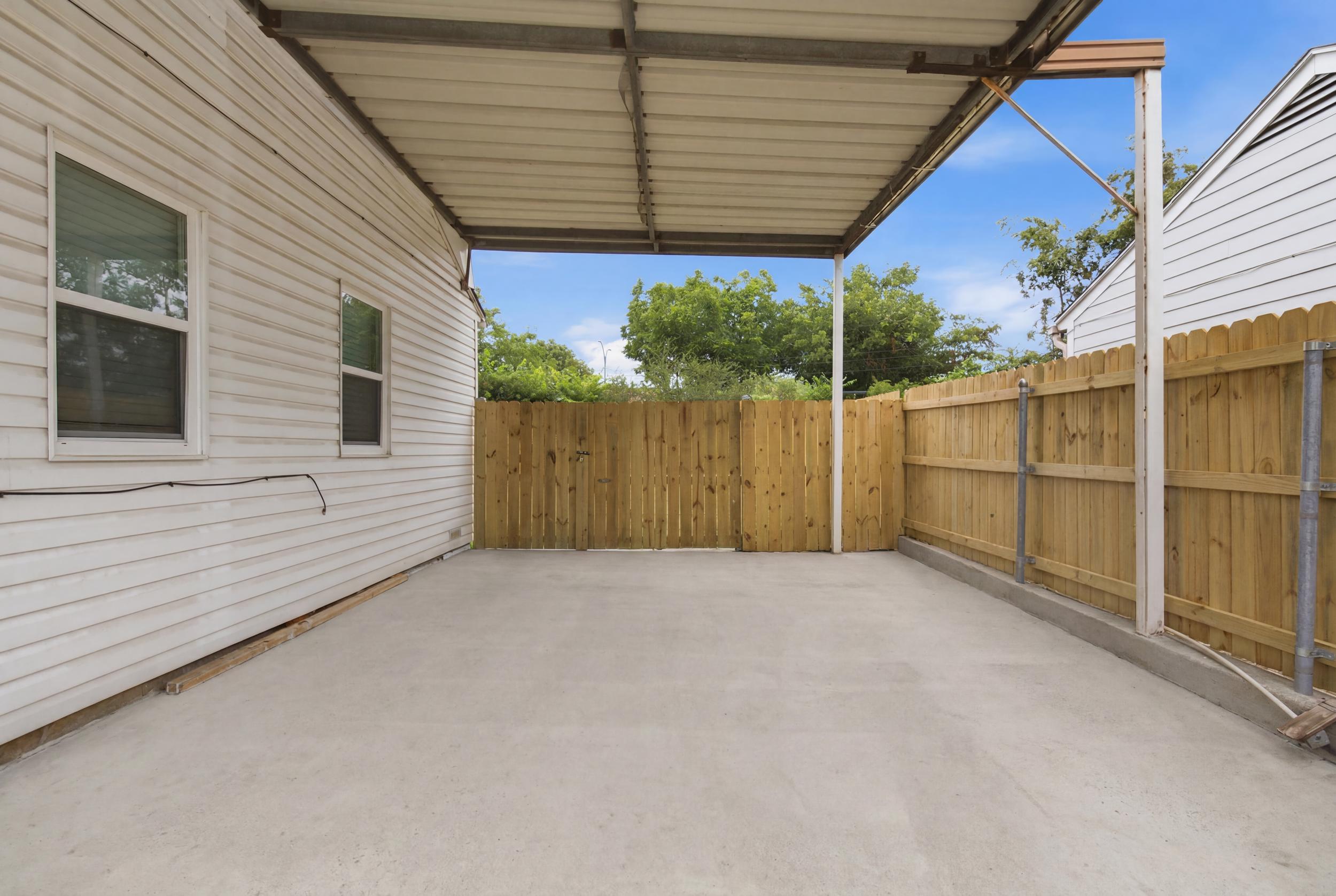 Covered Carport providing 1 protected Parking Spot, with additional Driveway Parking for up to 3 cars total. Free On-Site Parking for the whole group.