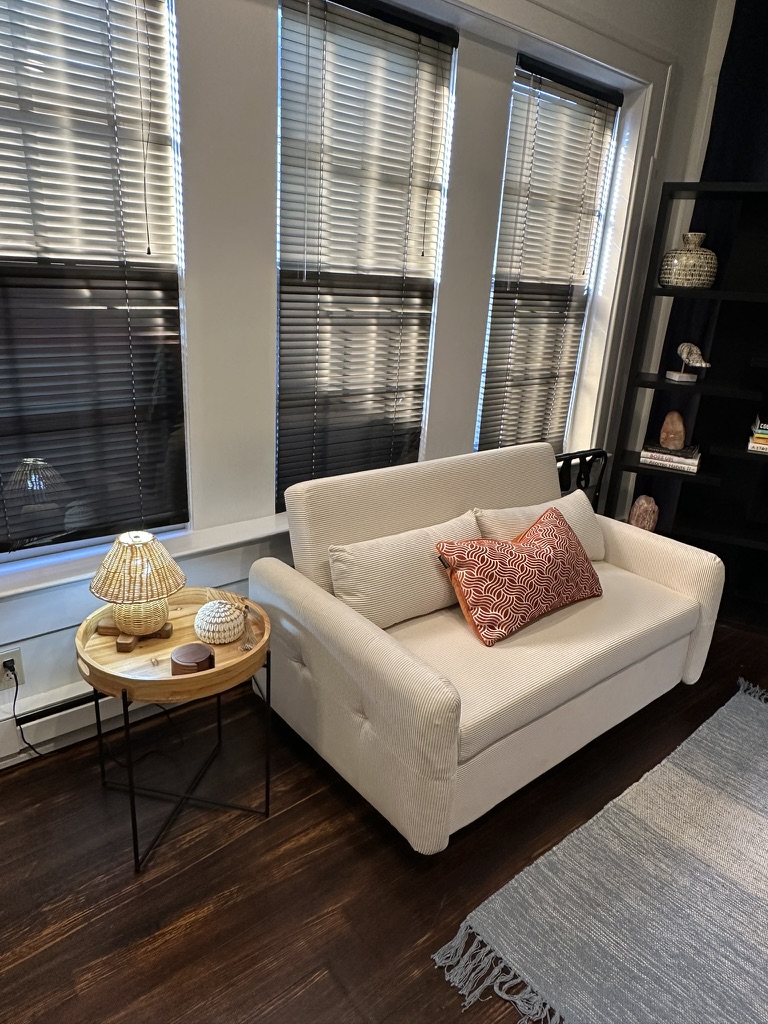 The Boho Room. Sitting area with pull out futon and lots of natural light. Smart TVs in all of our bedrooms.