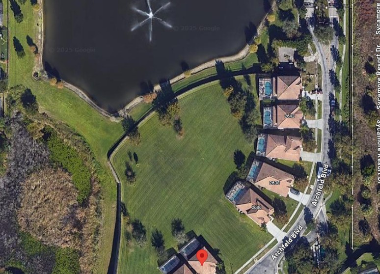 View of back yard, pond and peaceful green