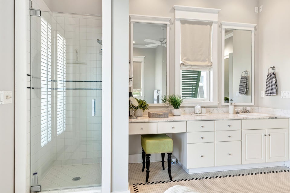 2nd floor king bedroom ensuite bathroom with double vanity, tub and shower.