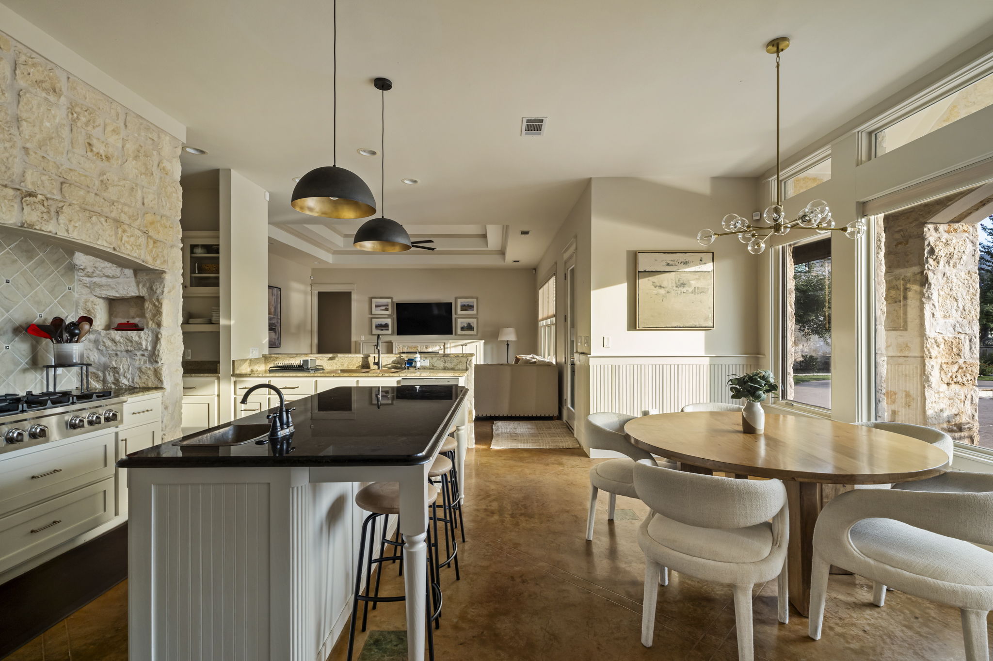 Fully stocked chef’s kitchen with island seating.