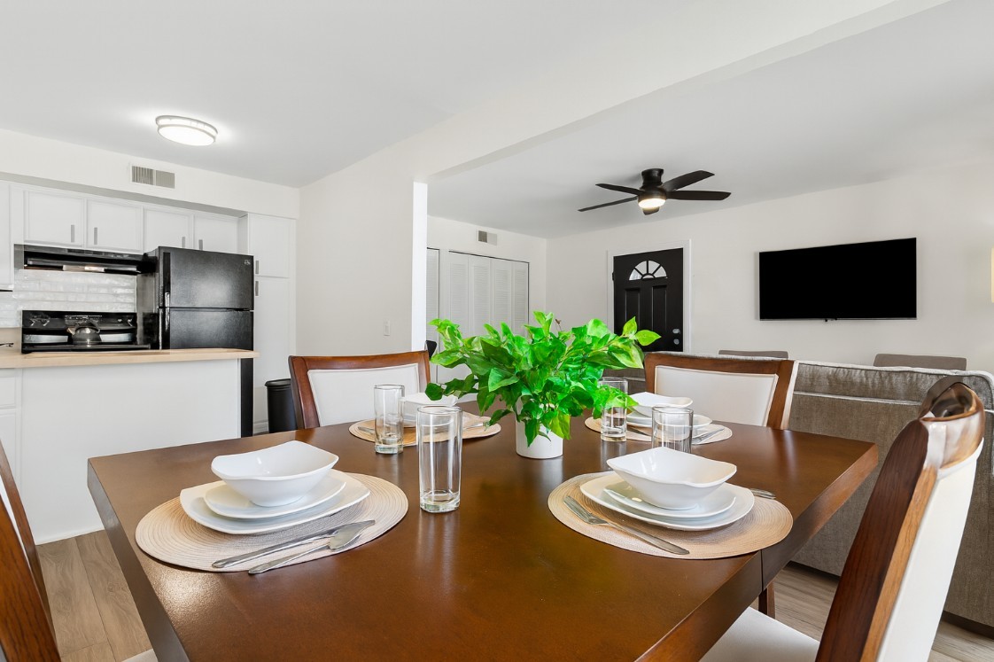 Chic dining area with seating for four, perfect for shared meals or work sessions.